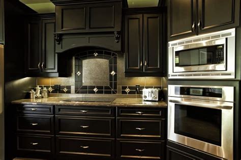 Black trim and crown molding set off a dark, antique william and mary highboy and a calcutta gold and black marble basketweave tile floor. 27 Beautiful Photos of Dark Cabinet Kitchen Designs You'll ...