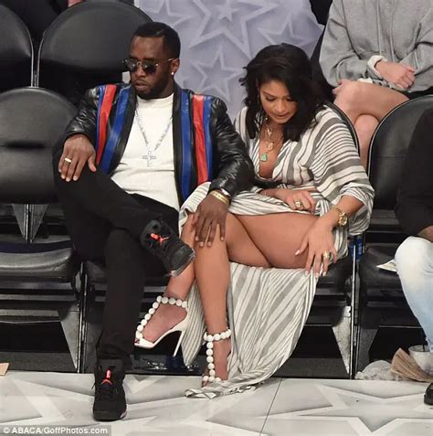 Diddy S Cuddles Gorgeous Girlfriend Cassie As She Flashes Major Leg At NBA All Star Game