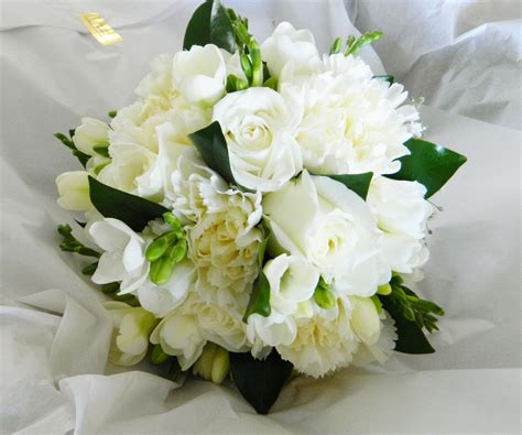 All White Bouquet Of Roses Carnations Freesias And Greenery White