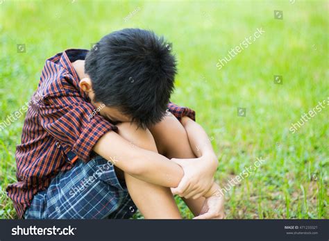 Sad Boy Sitting Alone On Meadow Stock Photo 471233321 Shutterstock