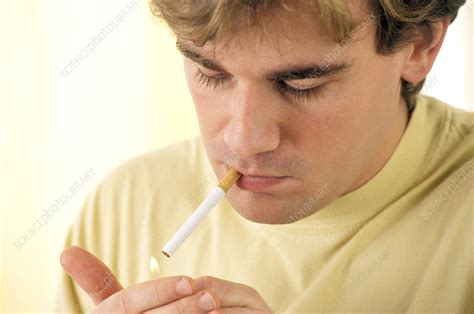 Man Lighting A Cigarette Stock Image M3701028