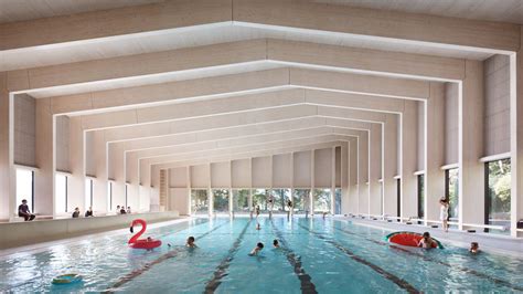 Swimming Pool In London Is Built Out Of Wooden Portal Frames And Cross