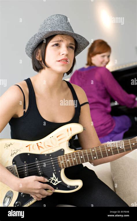Young Woman Playing A Guitar Stock Photo Alamy