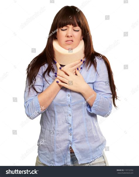 Woman Wearing Neck Brace Isolated On Grey Background Stock Photo