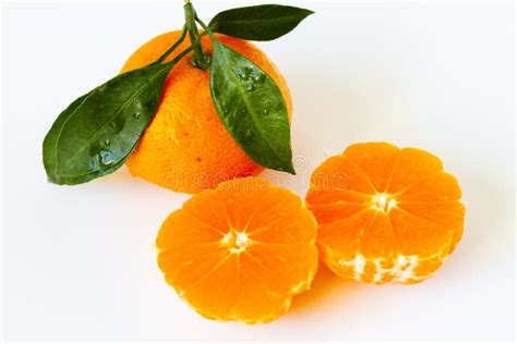 Tangerine Orange Or Clementine With Green Leaf With Sliced Orange Stock