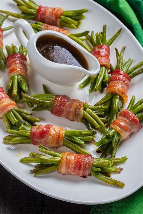This recipe has a lot of similar flavors, but presented in a way where the fresh green beans. Bacon Wrapped Green Bean Bundles | The Kitchen Magpie in ...