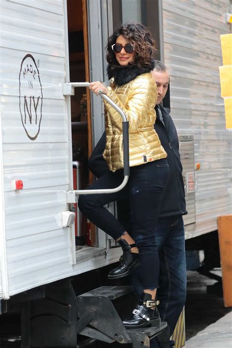 Priyanka Chopra Wears A Gold Puffy Coat With Dark Jeans On The Set Of