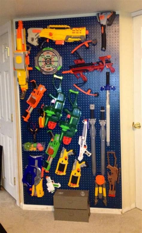 Hang nerf guns up on a pegboard. Nerf Gun Storage Rack | Organize it All | Pinterest | Nerf Gun, Nerf and Gun Racks