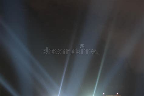 Searchlights Shining Beams Of Light Into The Black Sky Stock Image