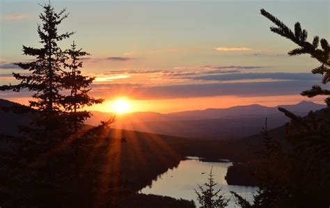 Sunset Over Mountains Lake And Pine Trees Vermont Stock
