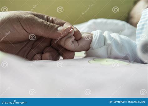New Born Baby Hand Holding Father Hand During Baby Sleeping Newborn