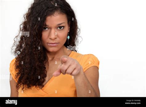 Women With Curly Hair Pointing Stock Photo Alamy