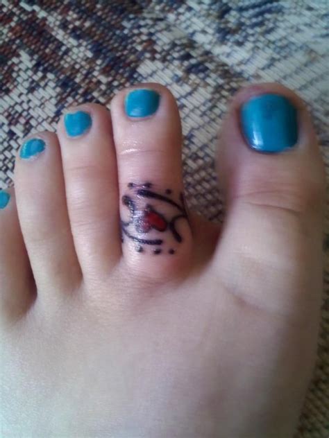 Finding the design you want for your wedding ring tattoo isn't the hard part—it's finding the reputable, experienced, licensed tattoo artist to ink your wedding ring tattoo. Toe Ring Tattoos | new toe tattoo...love it... my ...