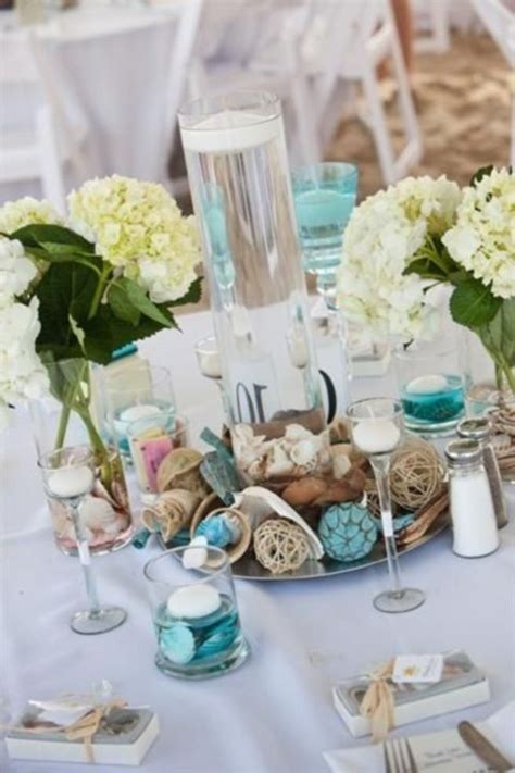 This romantic day is redefining everything you thought about coastal weddings. beach theme wedding centerpieces | Beach wedding reception ...