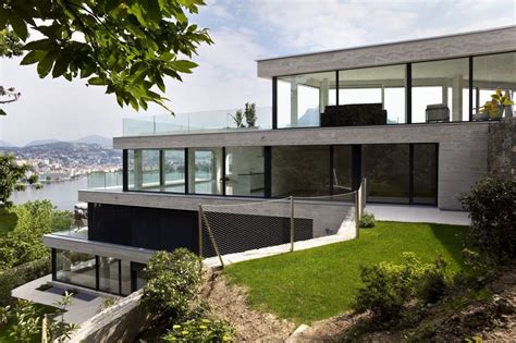 4 Story White All Glass Modern Home Cascading Down The Slope Of A Steep