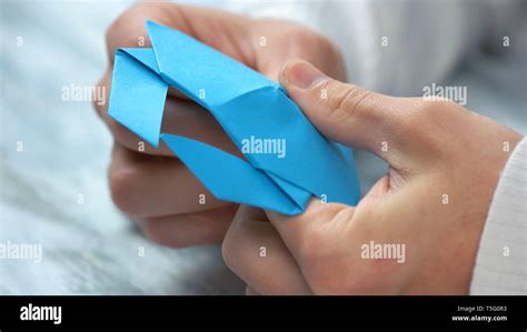 Close Up Male Hands Folding Origami Figure Stock Photo Alamy