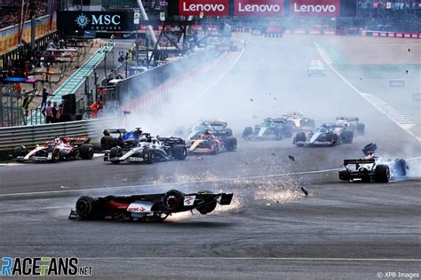 British Gp Stopped After Zhous Car Clears Tyre Barrier In Huge Start