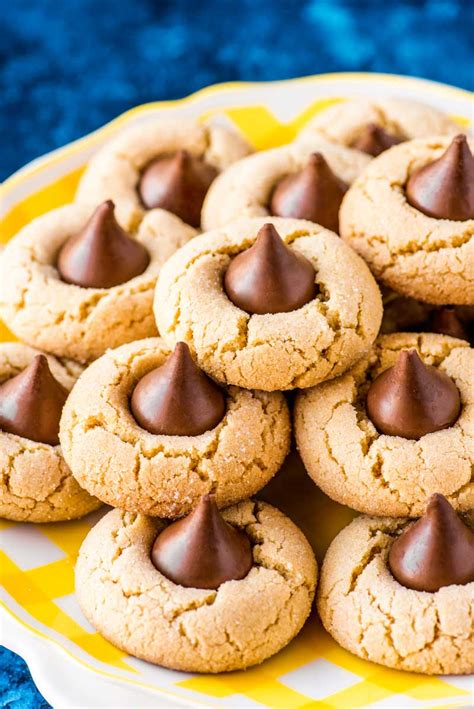 These hershey kiss cookies are probably one of the most recognizable cookies out there! Peanut Butter Blossom Cookies - Homemade Hooplah
