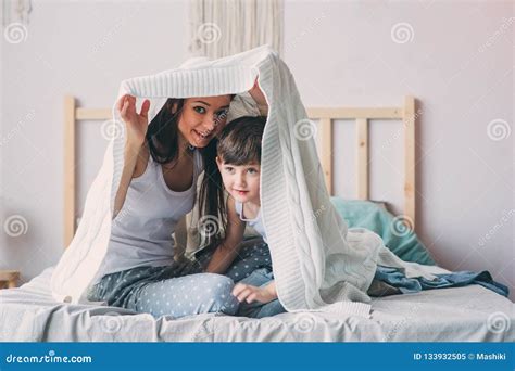 Happy Mother And Son Playing And Hiding Under Blanket In Bed Stock Image Image Of Hiding Life