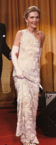 nancy reagan in a james galanos one shoulder gown of beaded lace over silk satin at ronald