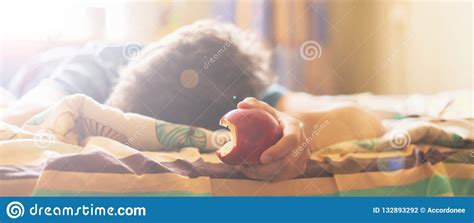 Person Sleeping And Lying In The Bed Abd Bite And Eat Fresh Apple F