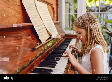 Little Girl Playing Piano High Resolution Stock Photography And Images