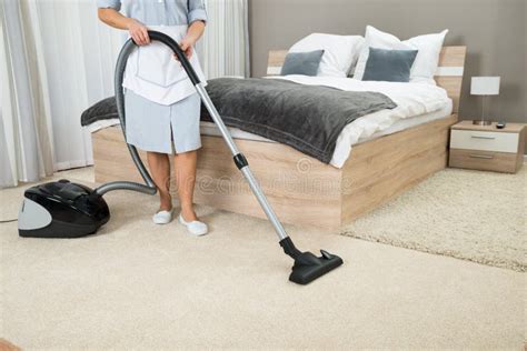 Female Housekeeper Cleaning With Vacuum Cleaner Stock Photo Image Of