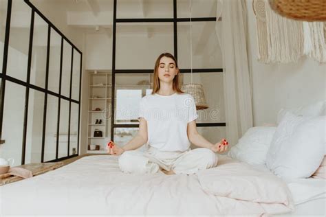 Woman Practicing Meditation On Bed Stock Photo Image Of Bedroom