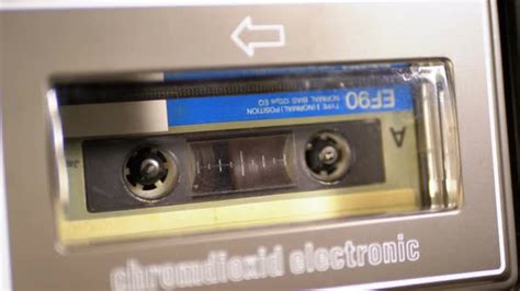 Insert An Audio Cassette Into A Tape Player And Playback Stock Footage