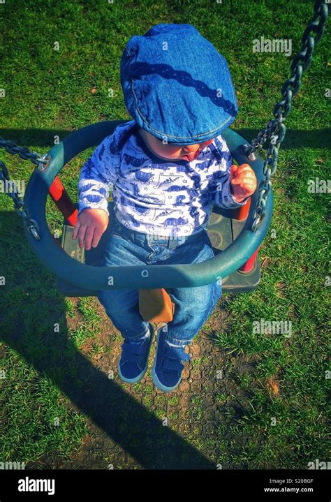 Baby In A Baby Swing Stock Photo Alamy