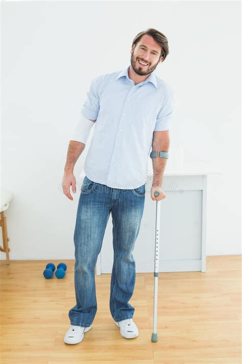 Young Man With Crutch And Dumbbell Stock Photo Image Of View Crutch