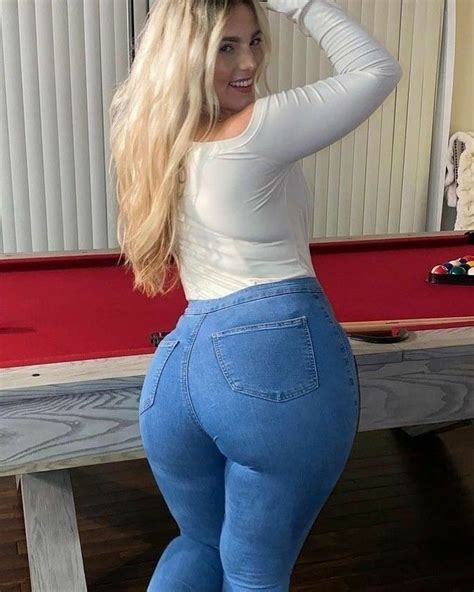 curvy woman in high waist jeans and heels