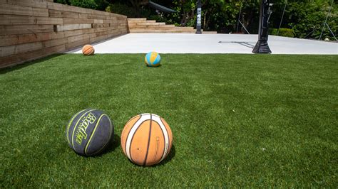 The outfield grass was chosen as the owner used a wheelchair and the shorter pile of this grass made for easier manouverability. Artificial Turf and Porous Grass Pavers | Greenbank Seattle