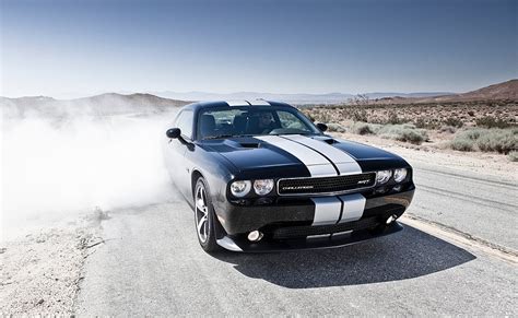 The srt8 392 is ginormous, impractical and eats like a teenager with the munchies. 2013 Dodge Challenger SRT8 392 - egmCarTech