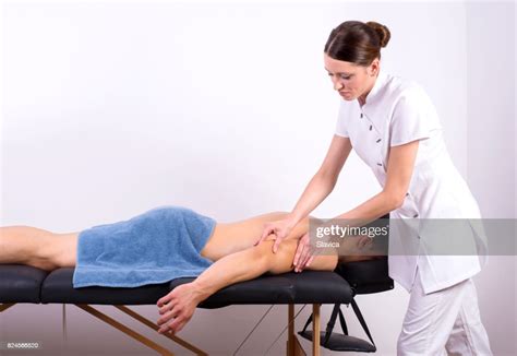 Young Handsome Muscular Man Enjoying Back Massage In Health Spa High