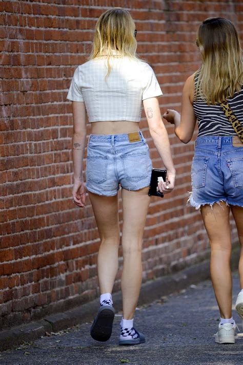 Sophie Turner Looks Cool And Casual In Denim Shorts And Yellow Crop Top