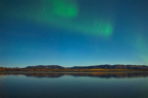Northern Lights And Fall Colors At Calm Lake Yukon Territory Canada