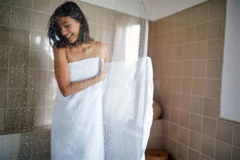 A Young Girl Full Of Satisfaction After A Warm Shower In The Bathroom