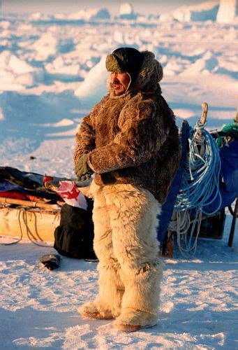 An Inuit Hunter Dressed In Polar Bear Pants And Boots With Reindeer