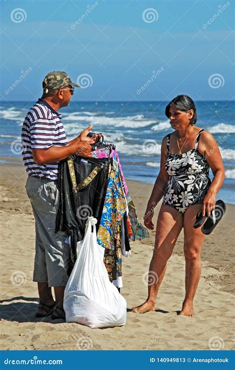 Beach Trader And Woman On The Beach Marbella Spain Editorial Stock