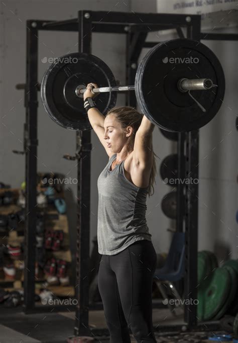 Strong Babe Woman Lifting Heavy Weights Stock Photo By Wollwerth