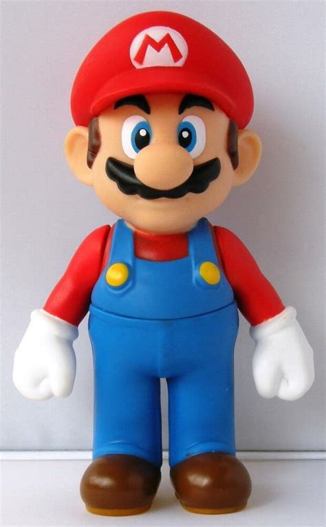 I wish i could have had a cake like this for my birthday yesterday. Super Mario Brothers 4.5 Inch Mario Cake Topper Figure Toy | eBay