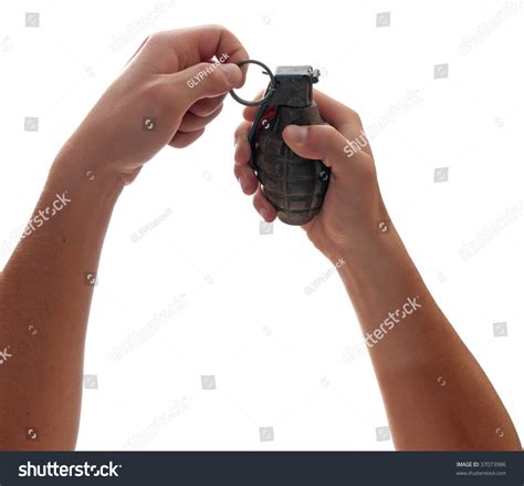 A Pair Of Hands Prepares To Pull The Pin On A Grenade Stock Photo