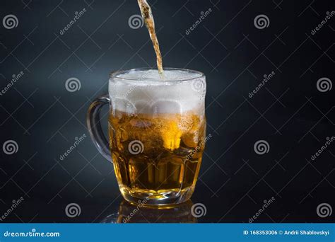 Beer Pouring Into Glass On Dark Background Stock Photo Image Of