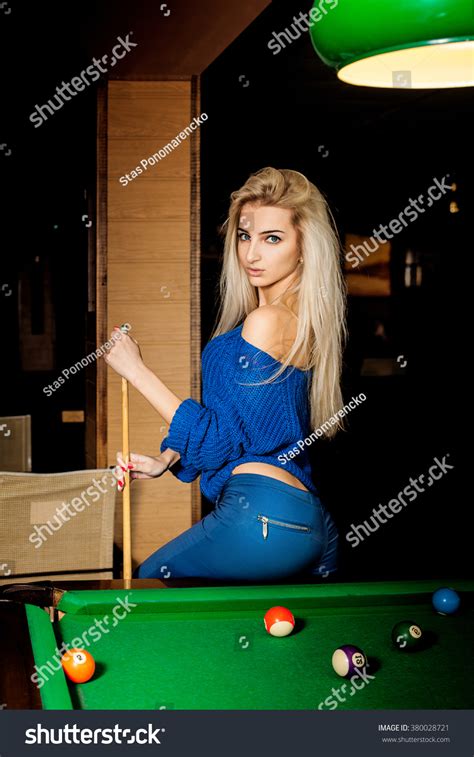 Hot Young Blonde Woman Posing On The Pool Table With The Cue Billiard Sport Concept American