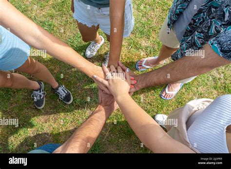 Teamwork Unity Concept Group Of Friends Put Their Hands Together Stock Photo Alamy