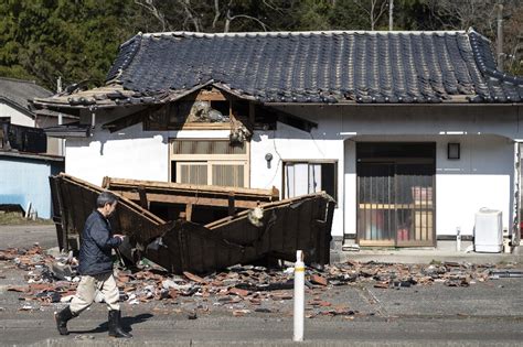 Residents Survey Damage After Powerful Japan Quake