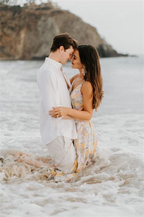 couples shoot in the ocean engagement pictures beach couples beach photography engagement