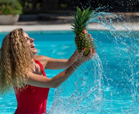 Caucasian Blonde Girl Plays With A Pineapple In The Pool Stock Image Image Of Girl