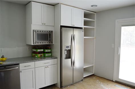 Looking for a college mini fridge microwave combo unit for dorms, apartments or other compact spaces? Customizing and hanging the Microwave Cabinet - Loving Here